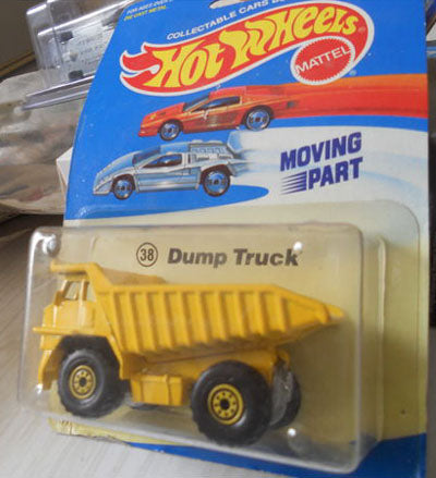 1989 Hot Wheels CAT Dump Truck yellow metal-bed experimental-card #38