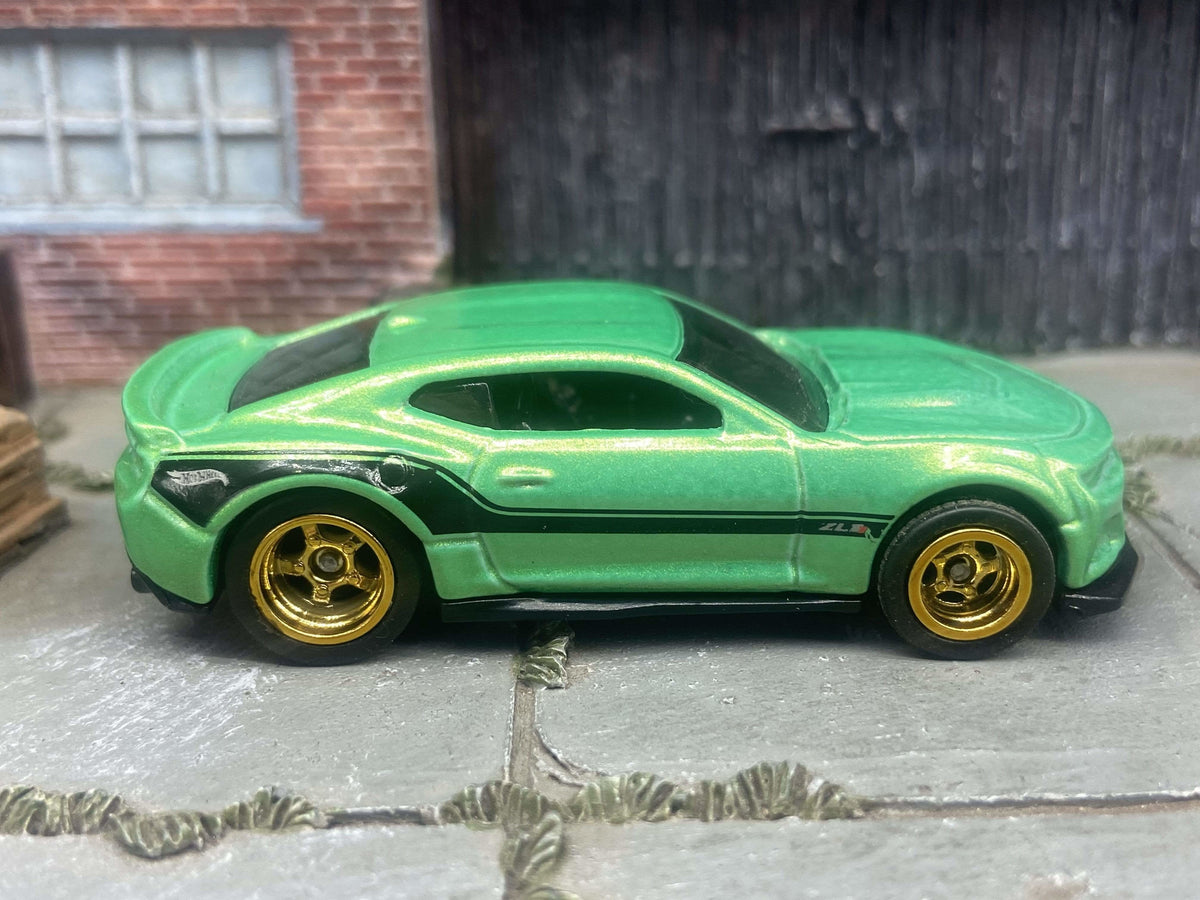 Modern Muncle Mikes custom Hot Wheels 2017 Camaro ZL1 in green and black with gold five-spoke wheels and rubber tires