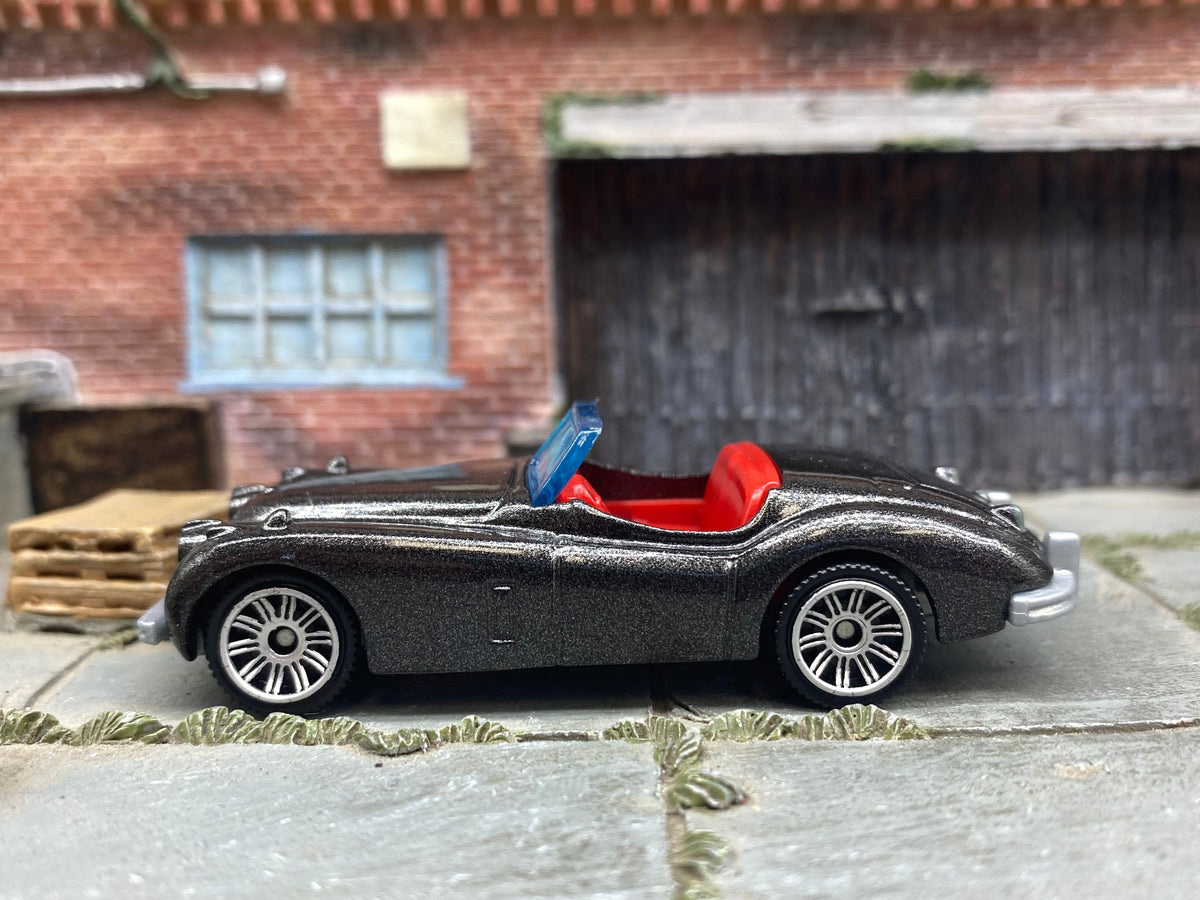 Matchbox 1956 Jaguar XK140 Convertible in Dark Gray Metallic, loose diecast car