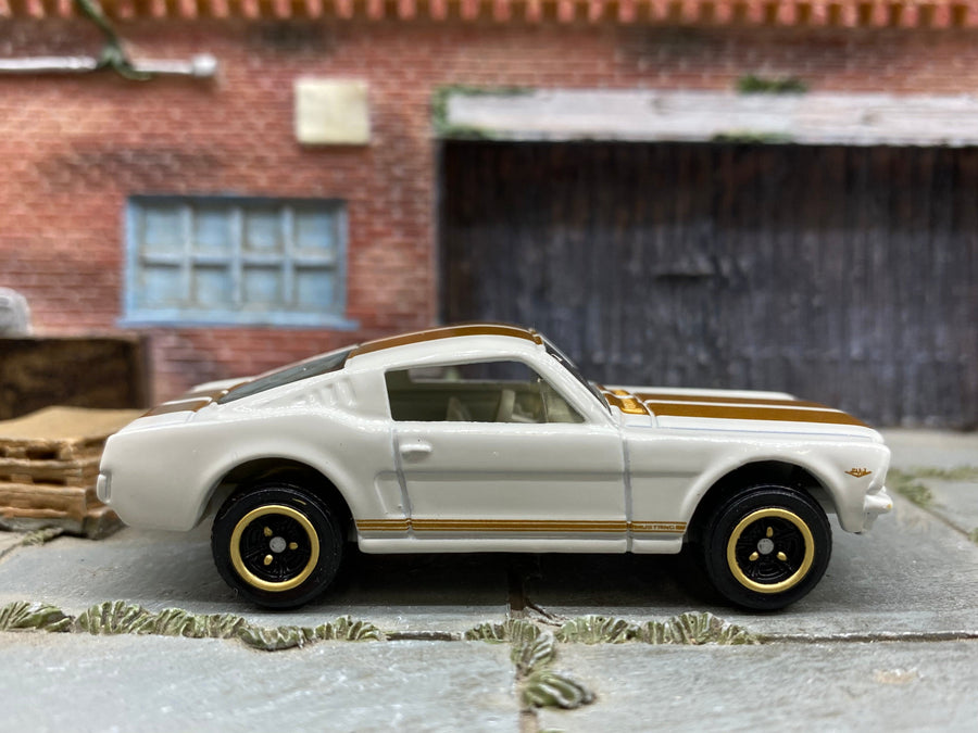 Matchbox 1965 Ford Mustang GT (Fastback) in White and Gold, loose diecast car