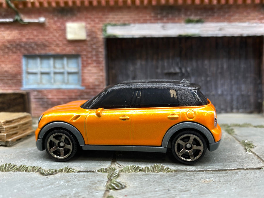 Matchbox 2011 Mini Cooper Countryman orange loose diecast - gallery image 1 of 3