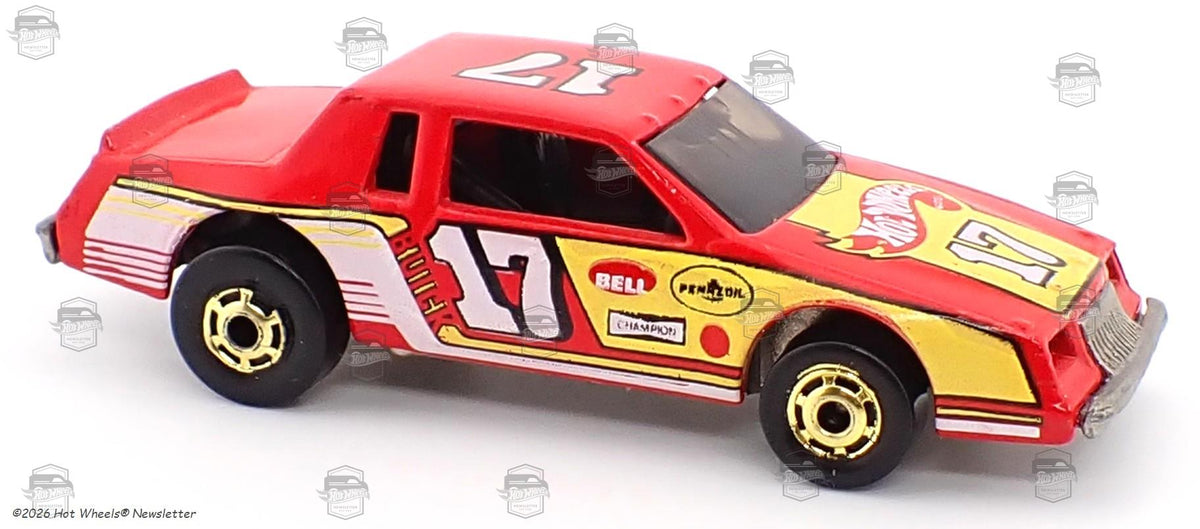 Red number 17 Stock Rocket Buick with yellow and white racing graphics and gold Hot Ones wheels