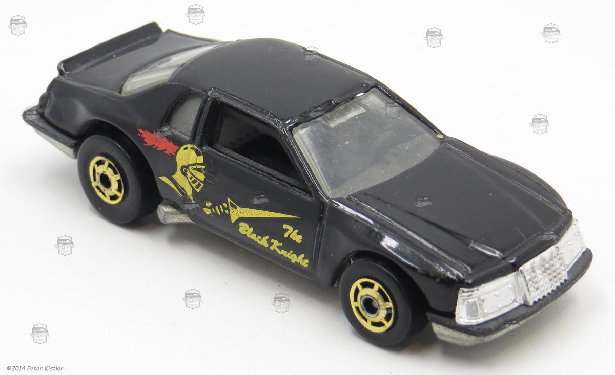 Black Thunderburner with yellow Black Knight side graphic, red plume and gold Hot Ones wheels