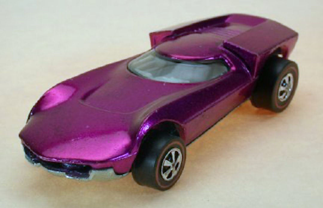 Magenta Turbofire with clear windshield, light interior and redline wheels, front three-quarter view