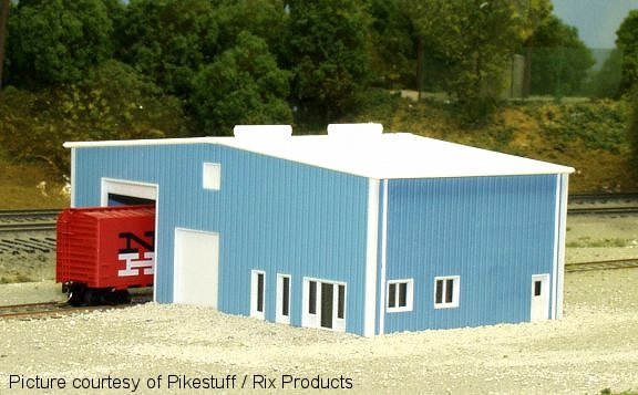 Pikestuff 541-0014 HO blue extension kit shown as part of an assembled industrial building
