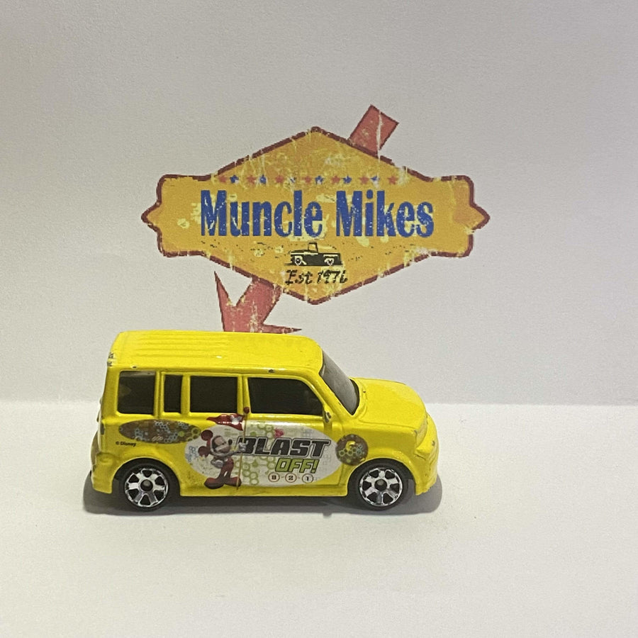 Yellow 2004 Matchbox Scion with Mickey Mouse Blast Off graphics, view 2