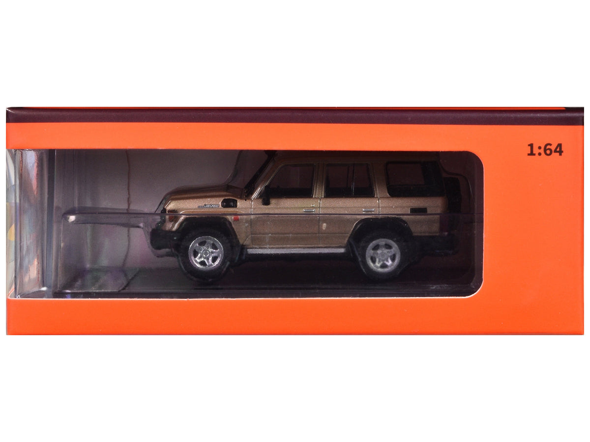 Boxed gold metallic GCD Toyota Land Cruiser J76 KS-081-457 in 1:64 scale
