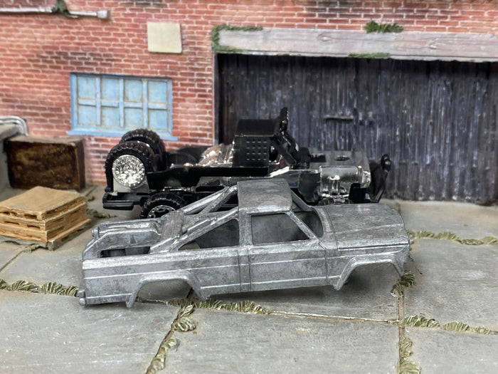 Disassembled 1973 Jeep J10 DIY kit with stripped body and chassis components