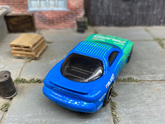 Custom Hot Wheels 1995 Mazda RX7 In Blue and Green Falken Tires With Black and Chrome Steel Wheels With Firestone Tires