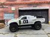 Custom Painted Hot Wheels Toyota Tacoma Off Road in Custom White Monster Energy Racing Livery With Green 5 Star Racing Wheels With off Road Rubber Tires
