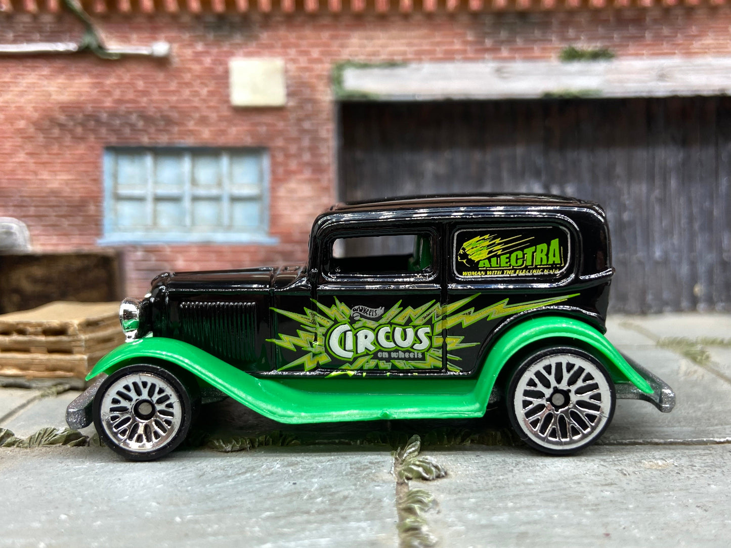 Loose Hot Wheels Ford Model A Sedan Dressed in Black and Green