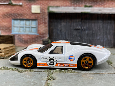 Loose Hot Wheels 1967 Ford GT40 MK.IV Race Car Dressed in White and Orange Gulf Livery