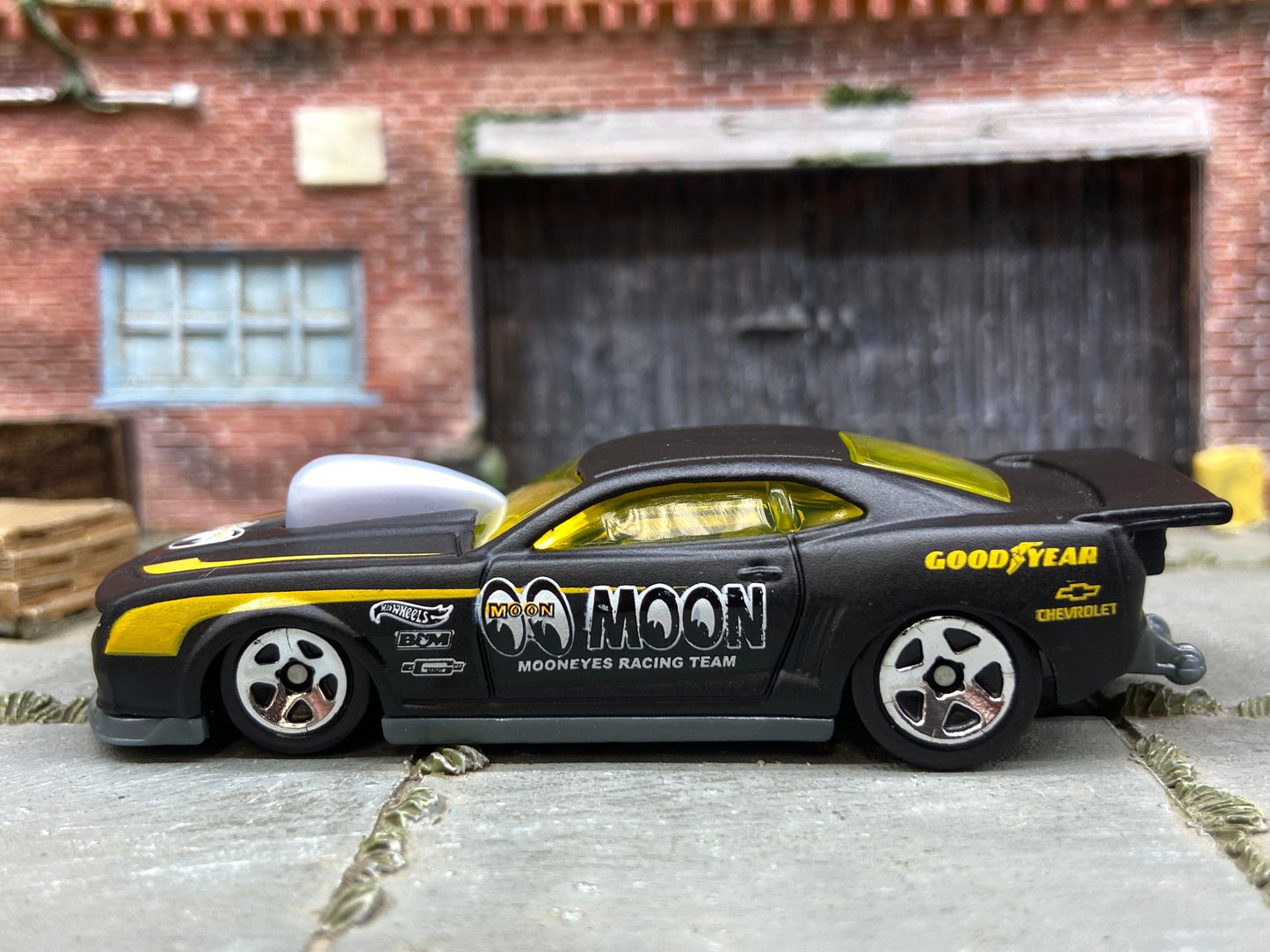 Loose Hot Wheels 2010 Pro-Stock Chevy Camaro Drag Car Dressed in Satin Black and Yellow Mooneyes Livery