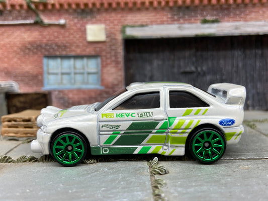 Loose Hot Wheels Ford Escort Rally Dressed in White and Green Race Livery