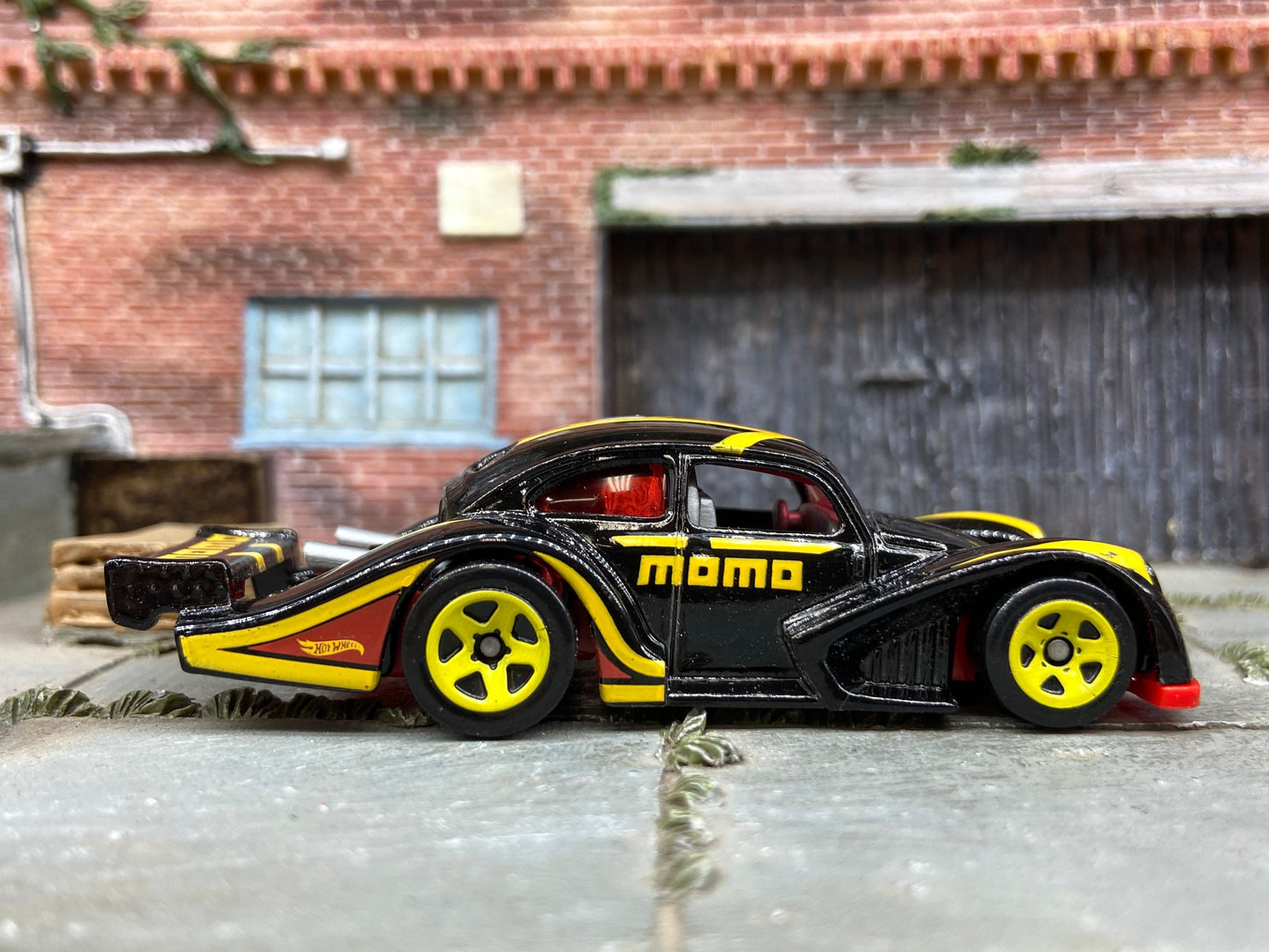 Loose Hot Wheels: VW Volkswagen Kafer Racer Race Car Dressed in Momo Black, Red and Yellow Livery