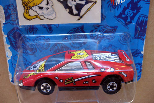 Red 1993 Hot Wheels Road Pirate with pirate graphics in Tattoo Machines packaging