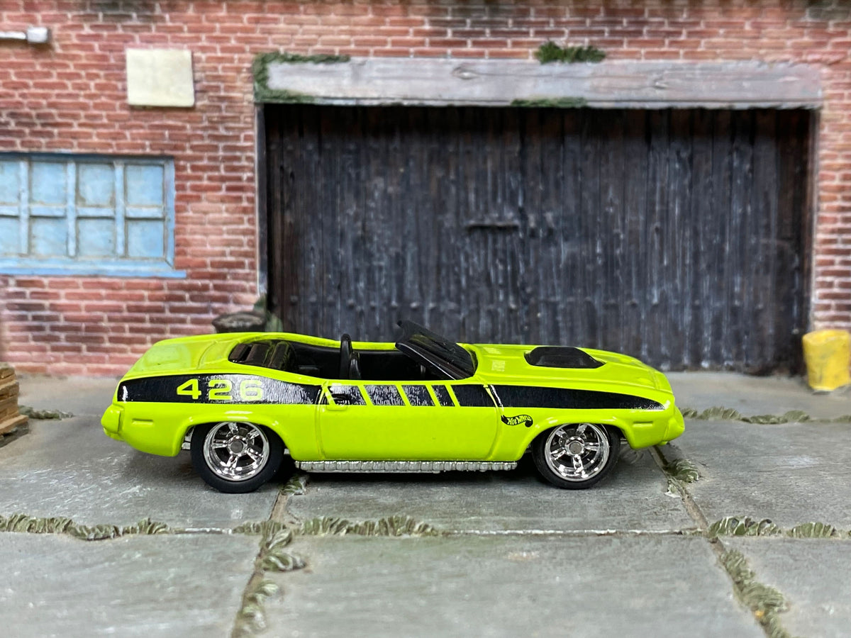 Side view of the lime-green King Kuda custom Hot Wheels with black 426 graphics and chrome wheels