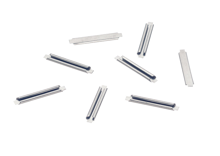 A group of Märklin 74994 metal C-track rail joiners; the package contains 24.