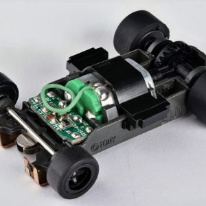AFX Mega G Plus rolling chassis representing slot car electrical pickup and contact maintenance