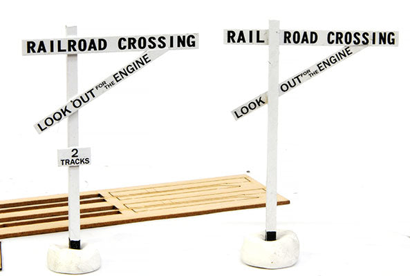 Assembled Banta Modelworks 6032 early style O scale crossing signs shown beside track; track separate