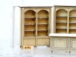 Banta Modelworks 701 O scale two-wide cabinet kit, assembled cabinet identified by the 701 label; surrounding furniture is separate.