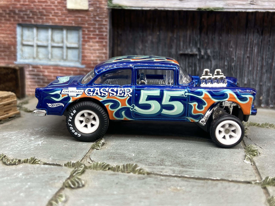 Muncle Mikes custom 1955 Chevy Gasser in blue with white six-spoke wheels and rubber tires; a modern custom, not a factory special edition