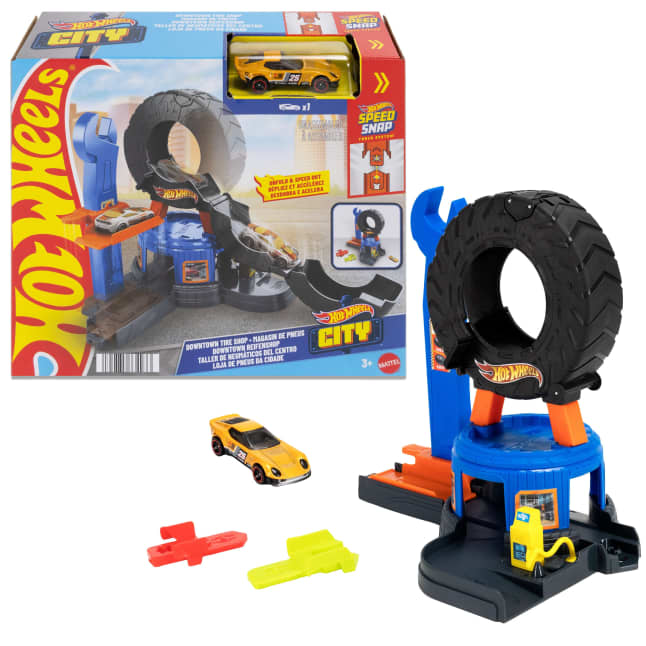 Hot Wheels City Downtown Tire Shop JHL75 with a large black tire, blue lift, yellow vehicle, two adapters and its retail box