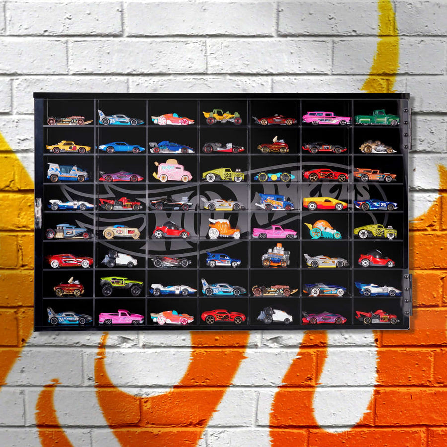 Mattel JNN88 display-case reference showing a cabinet format; placement and exposure still need assessment