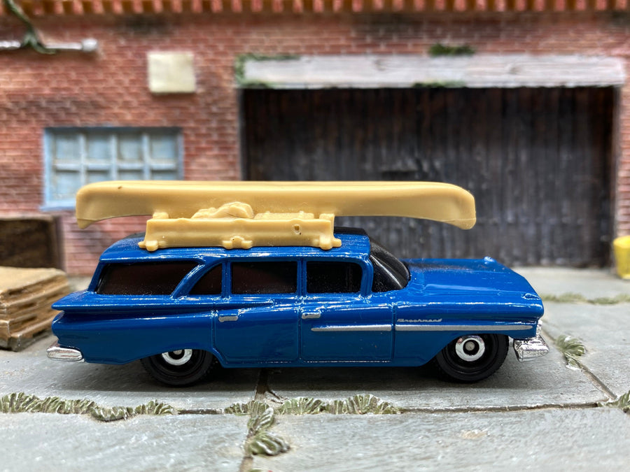Matchbox 1959 Chevy Station Wagon in Blue with a Boat, loose diecast car