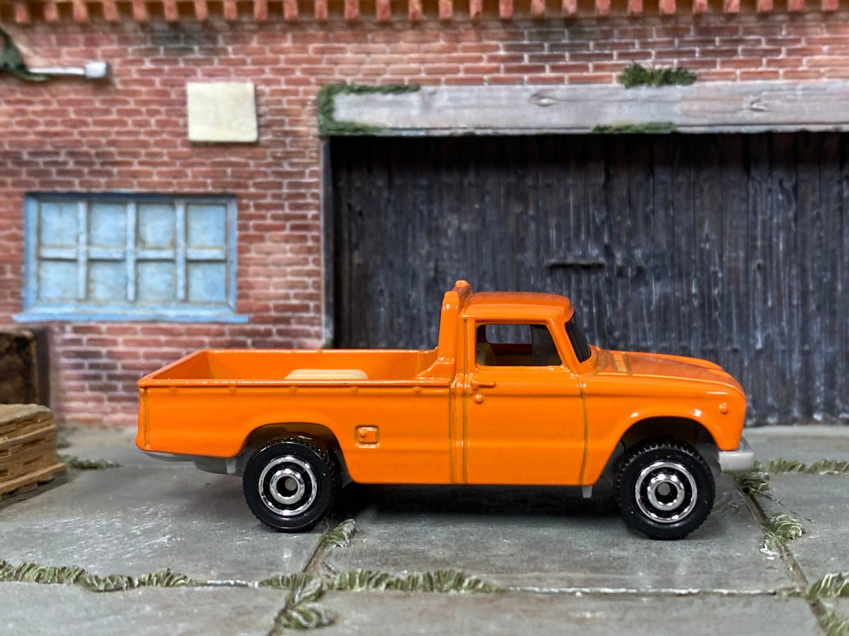 Matchbox 1962 Nissan Junior Mini Truck in Orange, loose diecast car