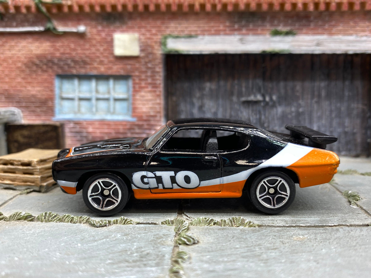 Matchbox 1970 Pontiac GTO in Black, Orange and White, loose diecast car