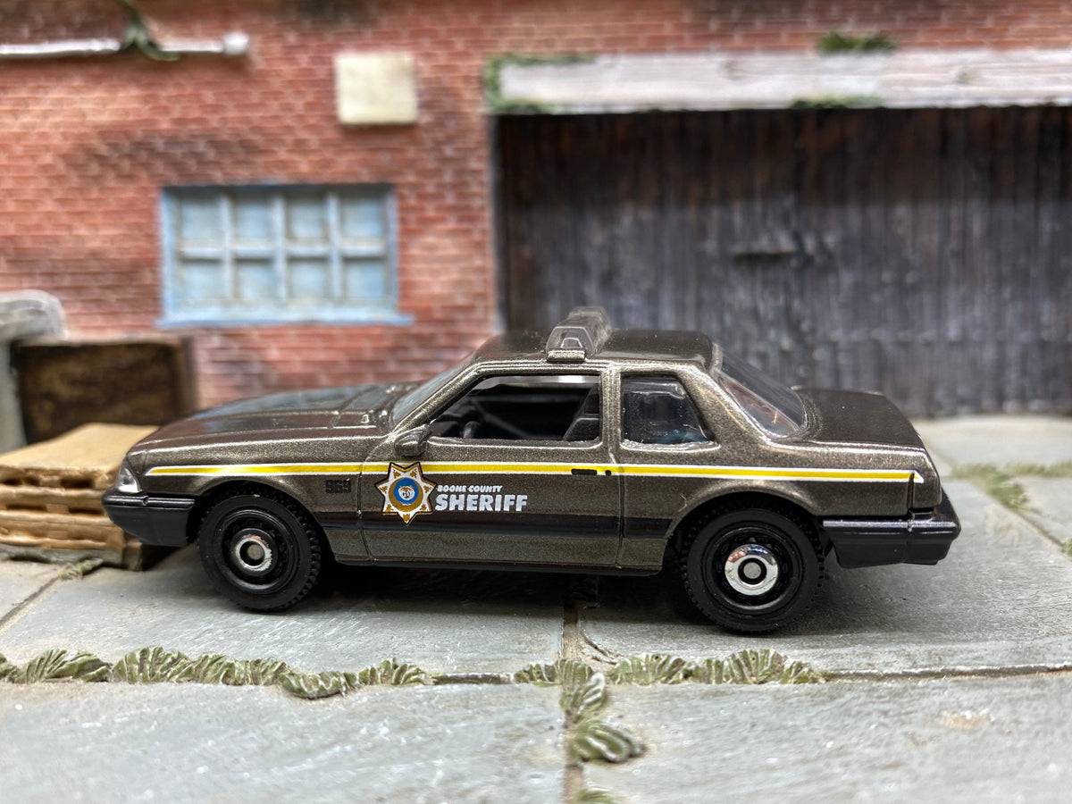 Matchbox 1993 Ford Mustang LX SSP Coupe in Brown and Black Boone County Sheriff, loose diecast car