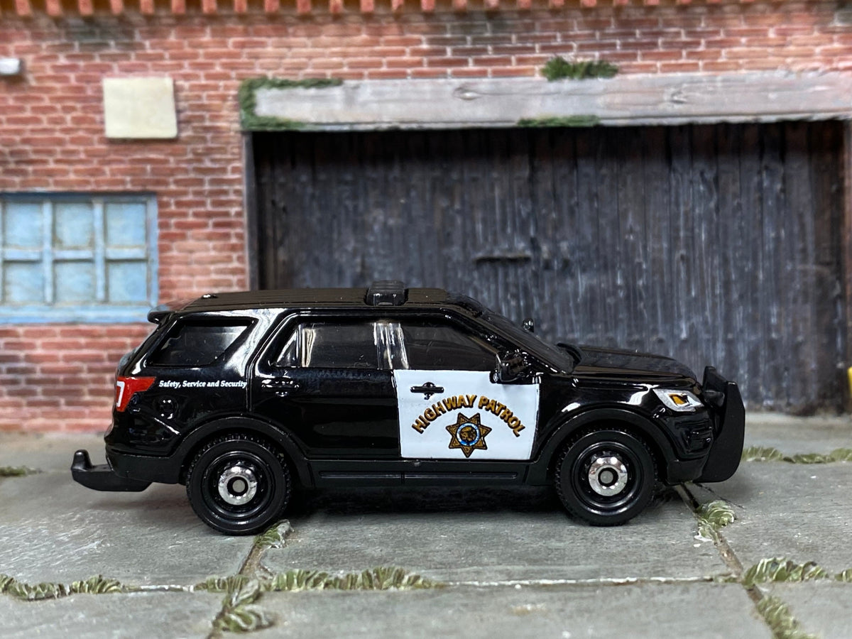 Loose Matchbox 2016 Ford Interceptor Utility Police Car in Black and White California Hiway Patrol - front three-quarter view 1:64 scale diecast