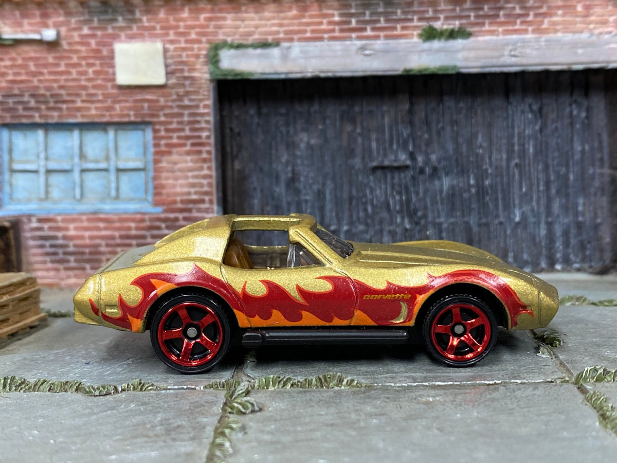Matchbox Chevy Corvette in Gold and Red with Flames, loose diecast car