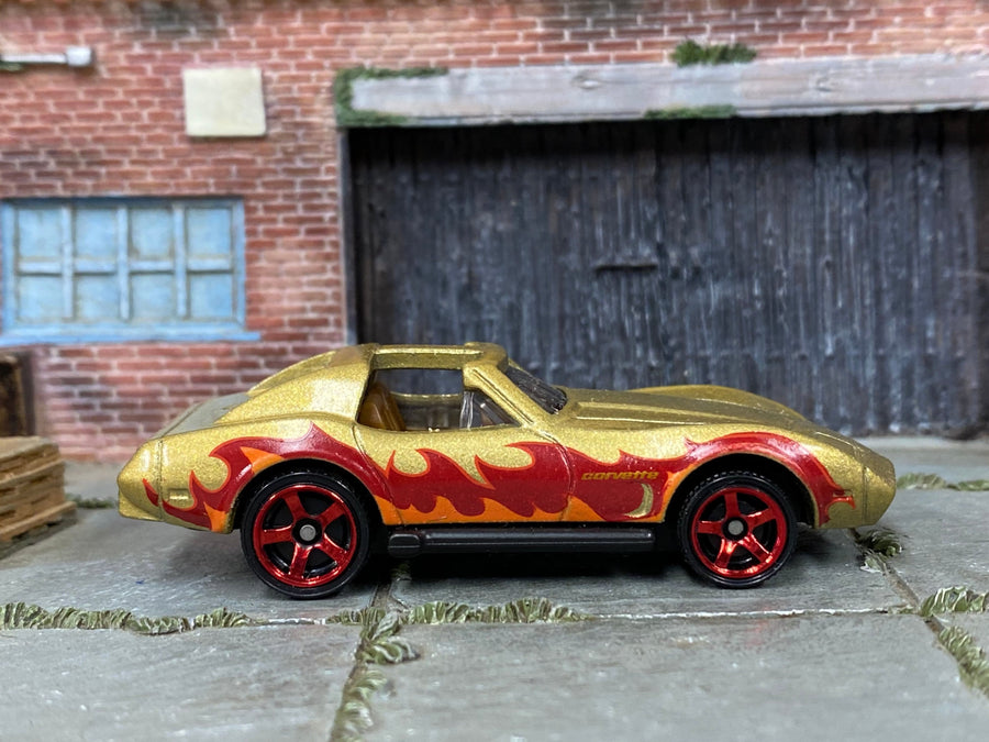 Matchbox Chevy Corvette in Gold and Red with Flames, loose diecast car