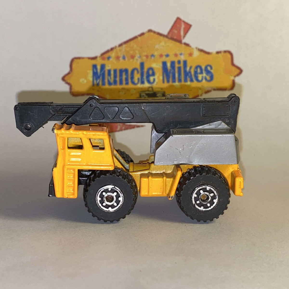Orange Matchbox Faun mobile crane with black boom, view 1