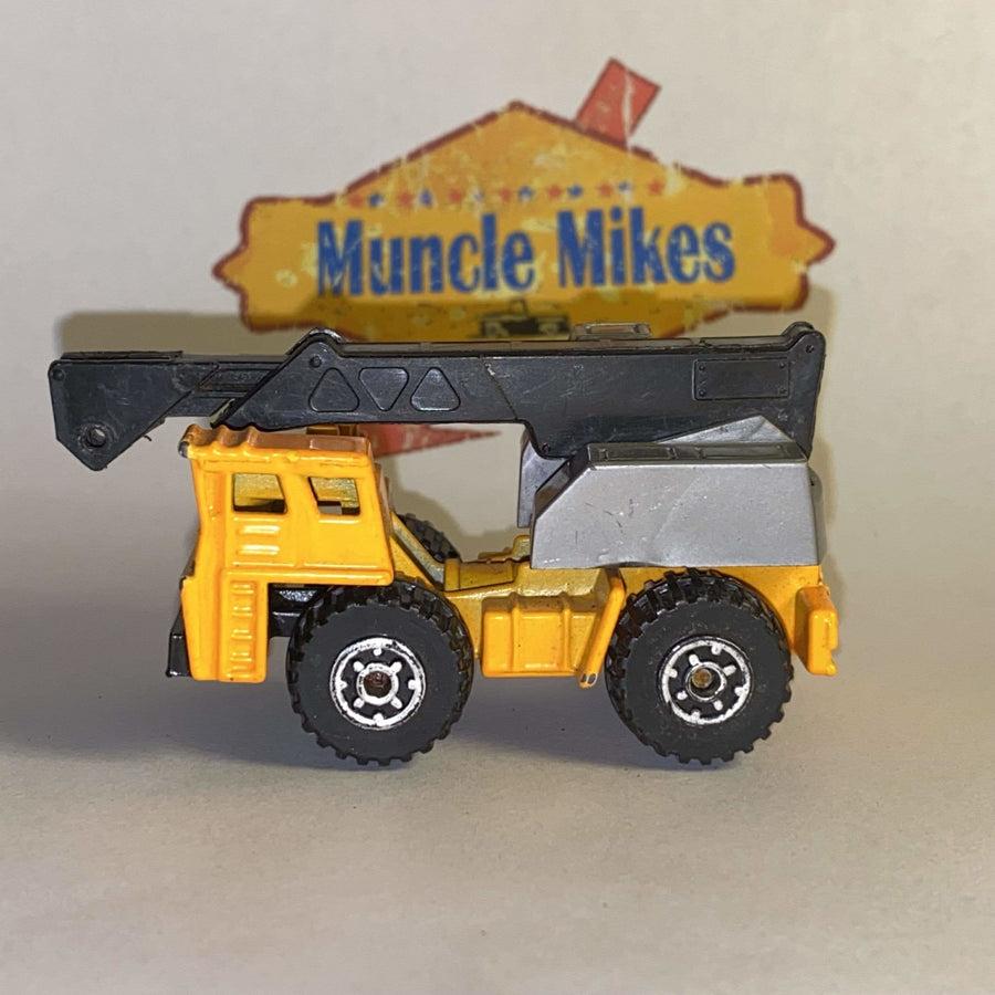 Orange Matchbox Faun mobile crane with black boom, view 1