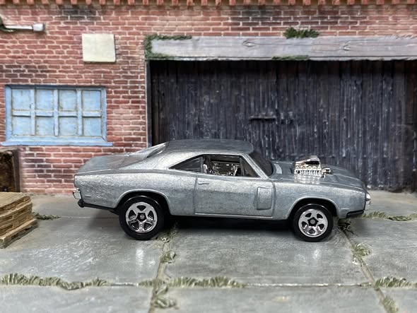 Bare-metal Hot Wheels Dodge Charger DIY donor shown from the side