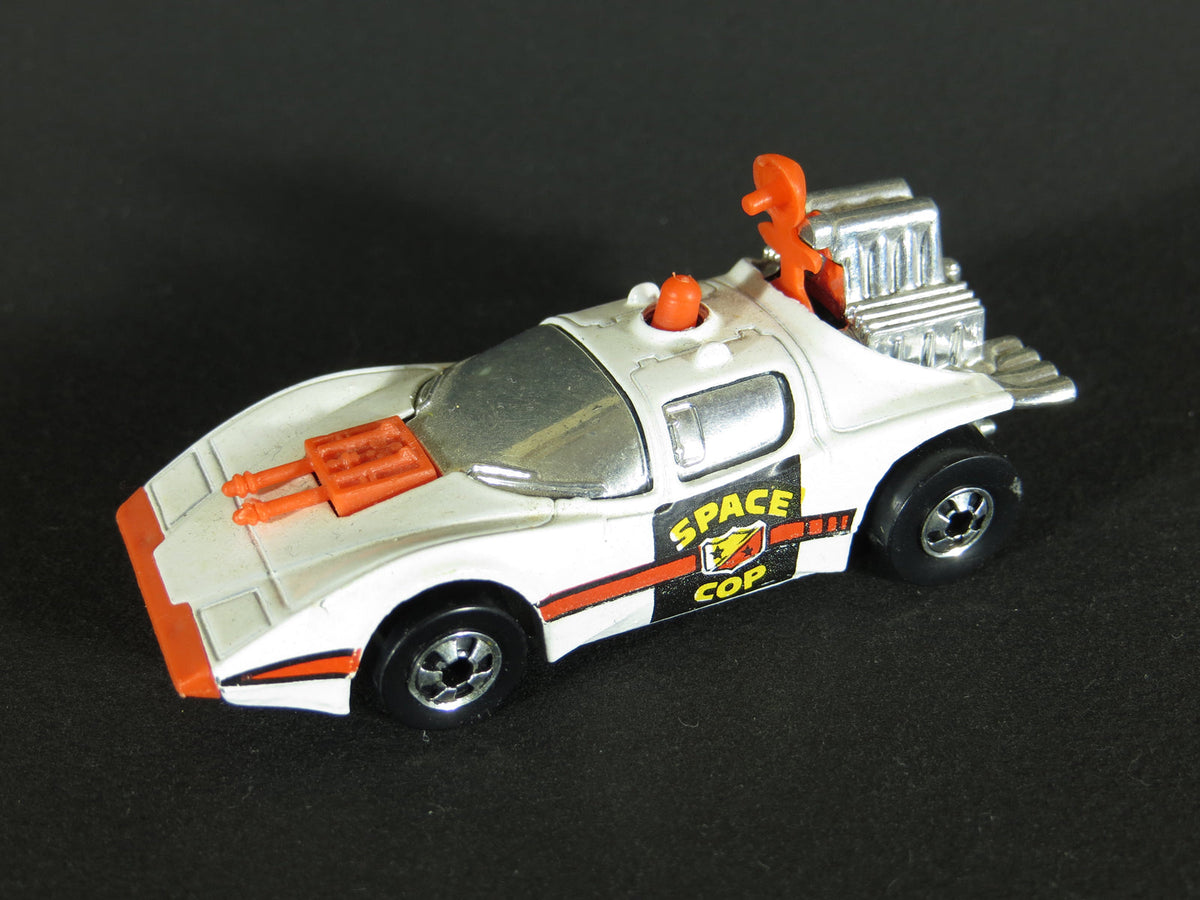 White Science Friction Space Cop with orange radar, roof light and front equipment, chrome-colored windows and blackwall wheels