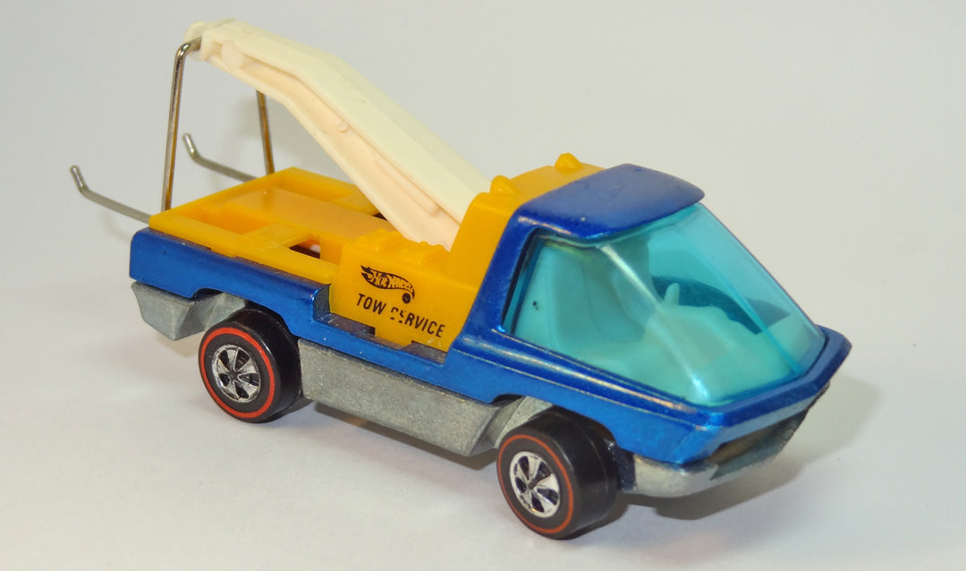 Blue Heavyweights Tow Truck with yellow rear unit, white boom, wire hitch and redline wheels