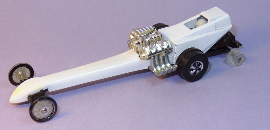 White Snake Rail dragster with exposed front engine, small front wheels and rear wheelie assembly