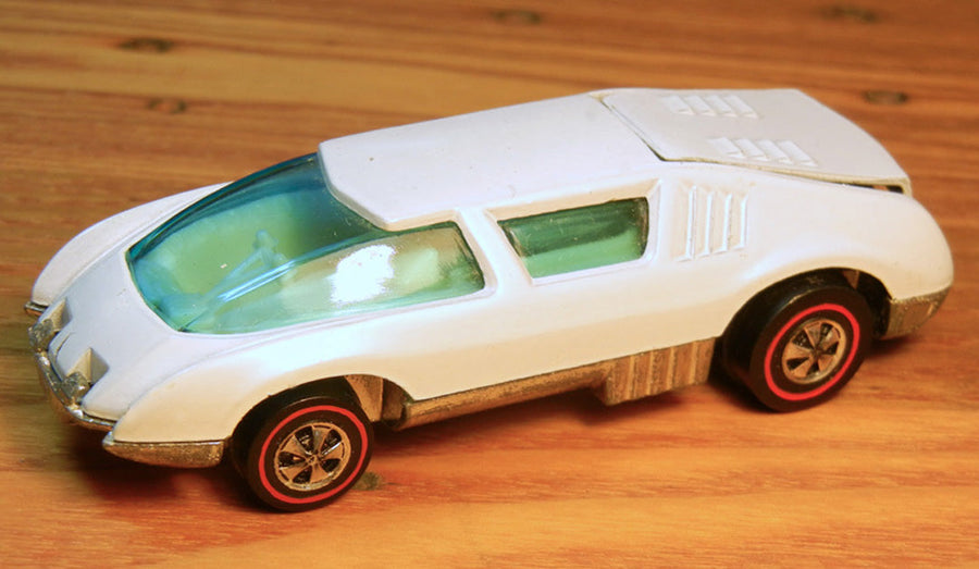 White Crew Car with blue wraparound glazing, light interior and redline wheels