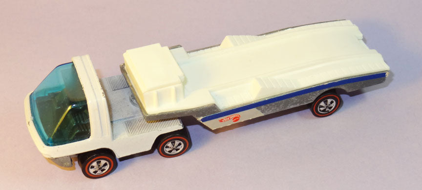 White Racer Rig with cream-colored trailer, blue side stripe, blue glazing and redline wheels