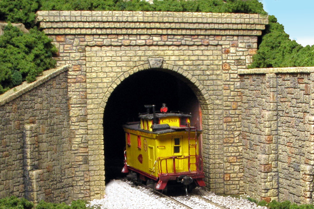 Monroe Models 112 HO scale random-stone single-track tunnel portal, painted layout example. Supplied unpainted; rolling stock, wing walls and scenery shown for context.