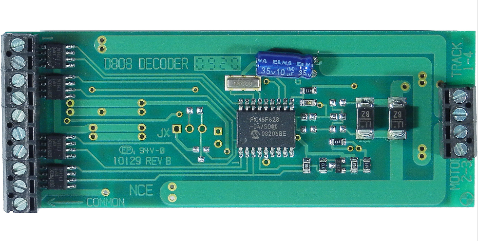 NCE 524-112 D808 decoder — close-up of the labeled circuit board and screw terminals.