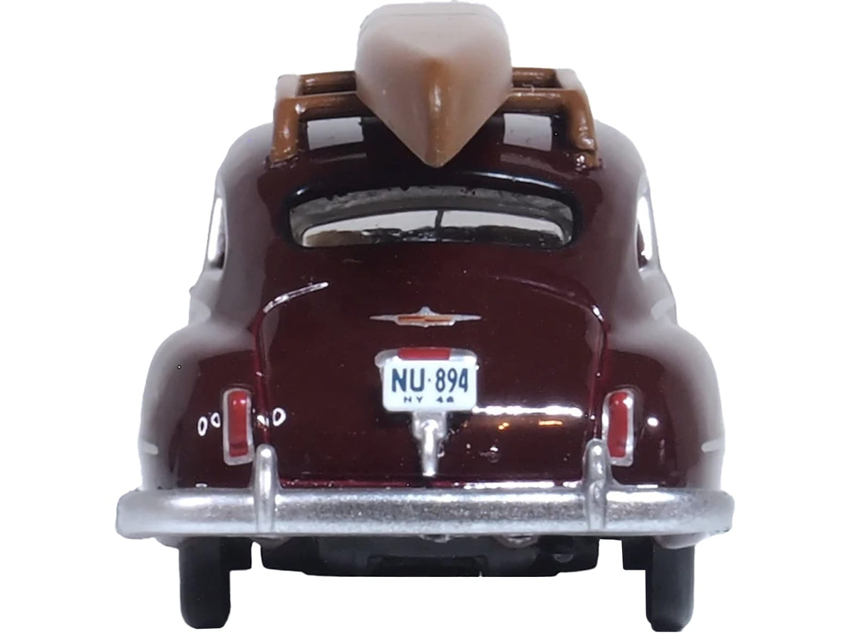 Royal Maroon Oxford 1946 DeSoto Suburban with roof rack and canoe