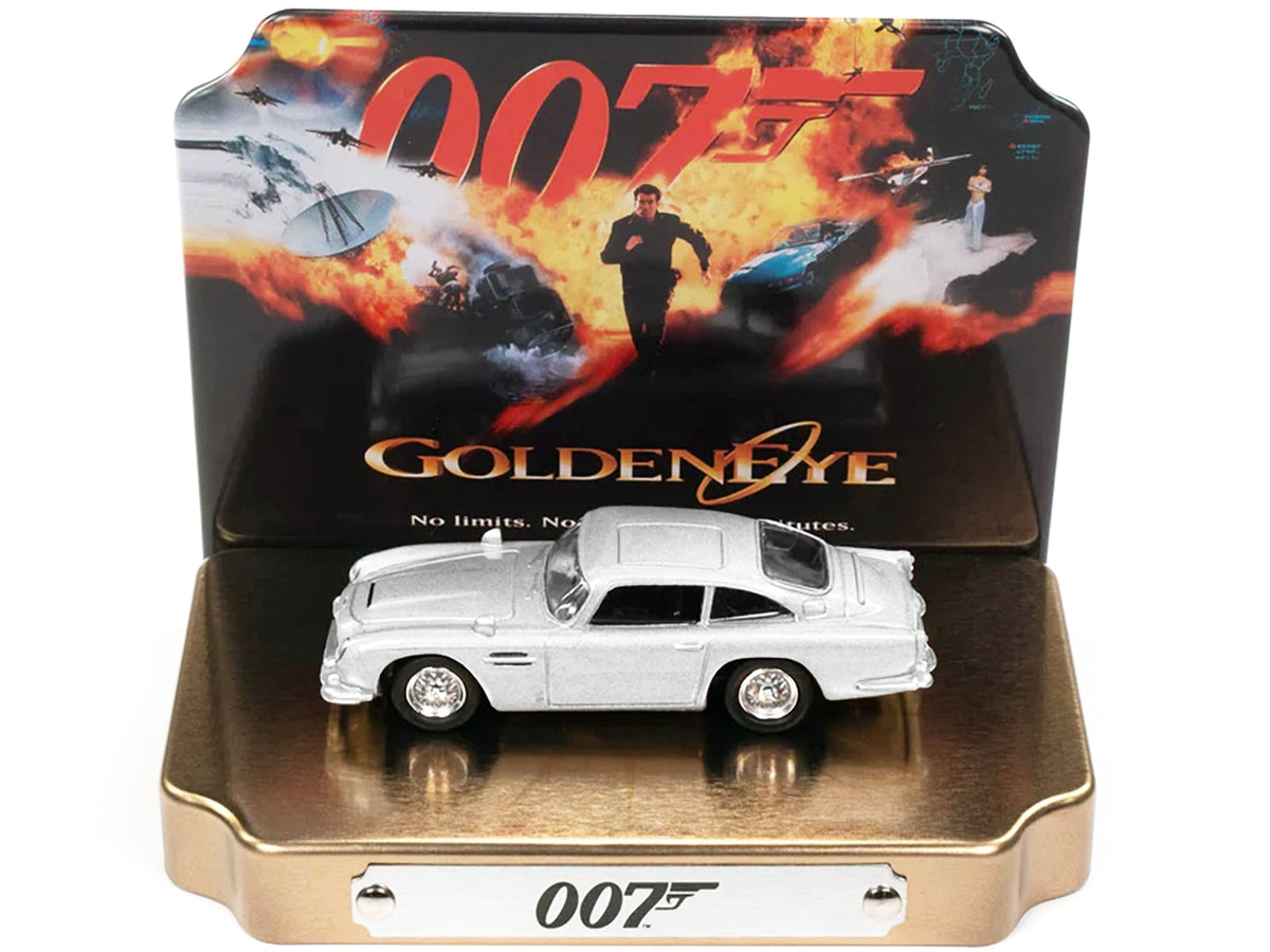 Silver Aston Martin DB5 GoldenEye Johnny Lightning model with collectible tin display