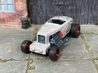 Custom Max Steel with rubber tires, rear three-quarter view