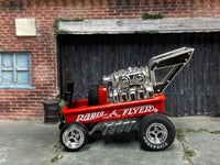 Red Radio Flyer Wagon custom with Firestone-lettered rear tire, left-side view