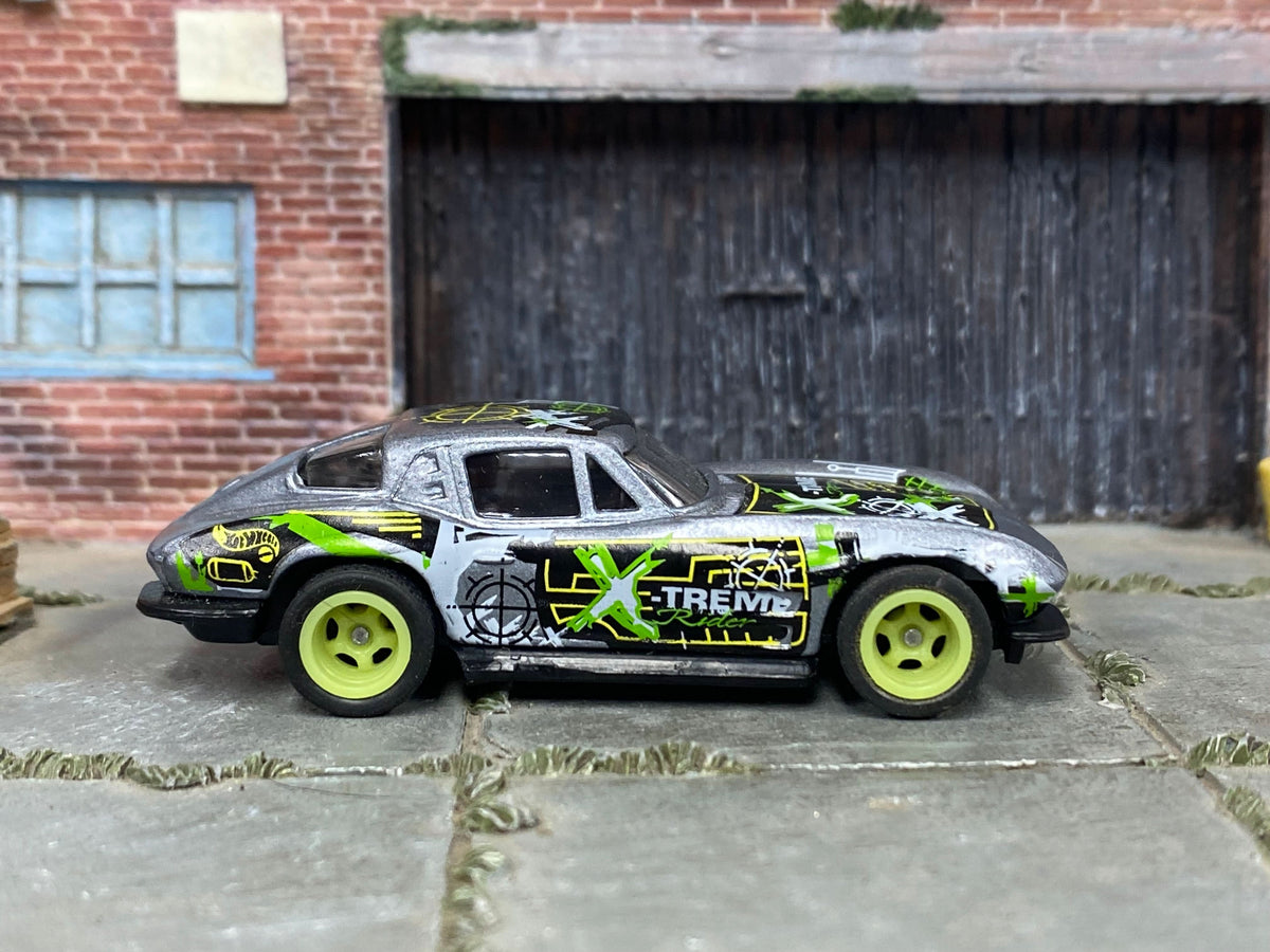 Silver, black and green Corvette Stingray custom Hot Wheels, front three-quarter view